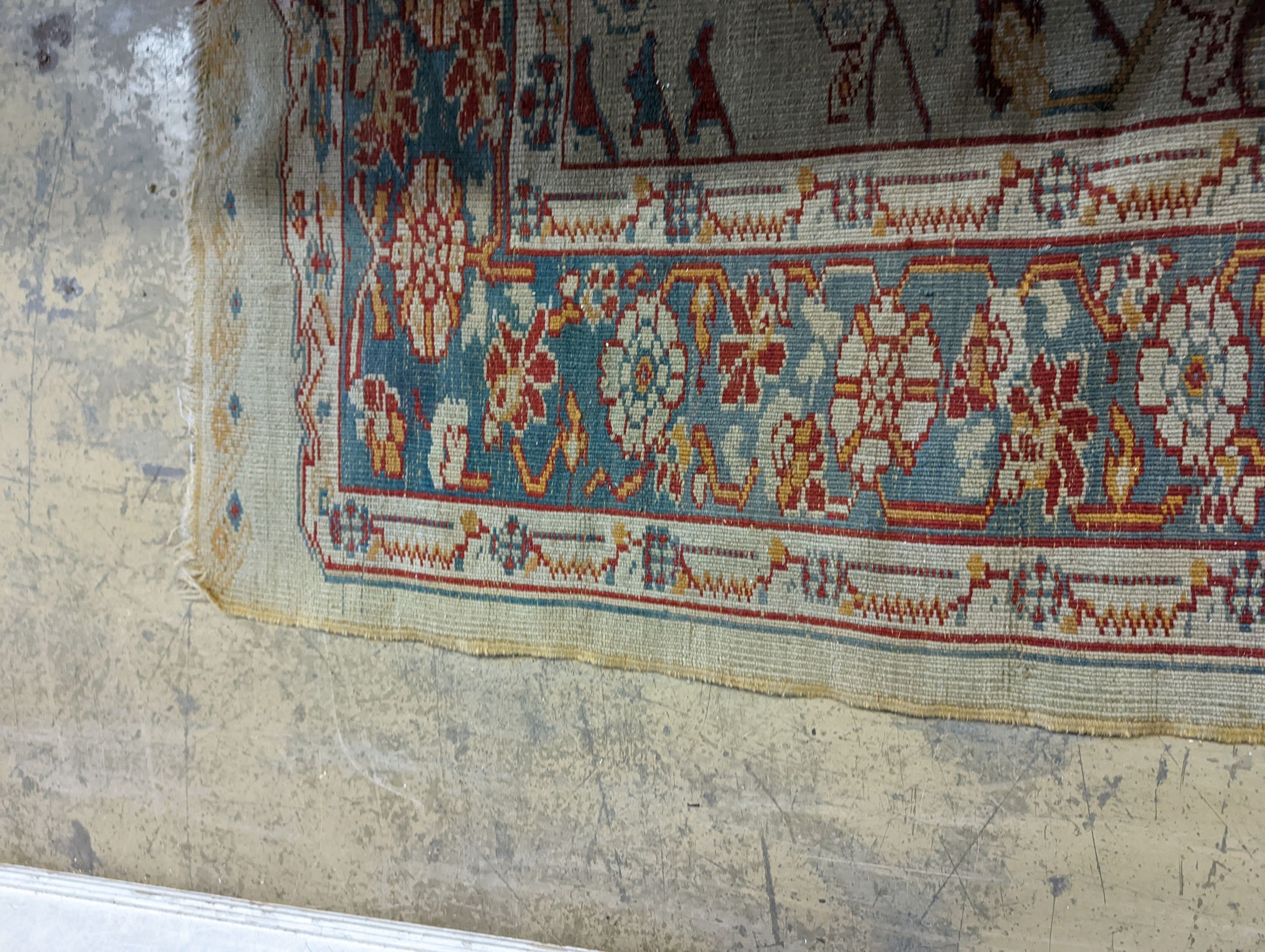 An antique Turkish? ivory ground rug, 218 cm long, 145 cm wide